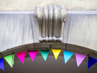 Colorful Bunting and Architectural Detail Above Archway