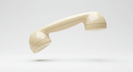 Vintage beige telephone receiver floating against a plain background