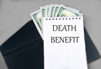 DEATH BENEFIT - words in a notebook against the background of a black envelope and banknotes