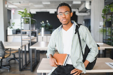 Young medical student studying in modern university library