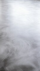 Obraz premium Gray textured surface, swirling patterns, smooth finish.