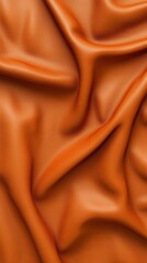 Textured orange fabric, softly draped folds.