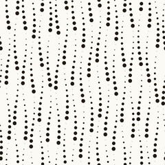 Vector seamless pattern. Dotted stylish background. Smooth waves with black circles. Elegant geometric swatch. Modern surface design.