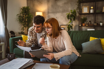 Young couple boyfriend and girlfriend or brother sister study at home