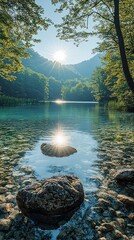 Sunlit lake reflecting sunlight, clear water with rocks visible on the bottom. Lush green forest surrounds the serene waterscape