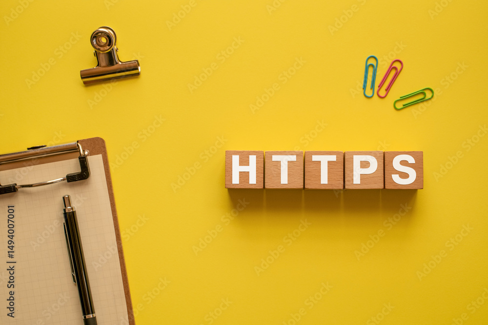 Poster there is wood cube with the word https. it is an abbreviation for hypertext transfer protocol secure