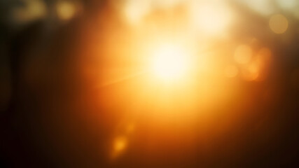 Warm glowing sunlight abstract background with lens flare and bokeh effects for design