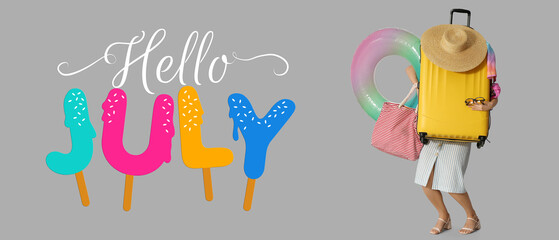 Young woman with suitcase, bag and  inflatable ring on grey background