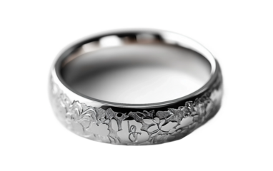 Detailed view of engraved wedding band with personalized initials and intricate design isolated on white background PNG