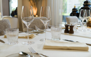 Empty wine glasses in the restaurant table background