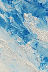 Aerial view of glacier with blue meltwater streams flowing through icy landscape abstract
