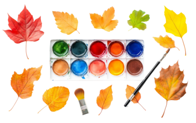 Artistic autumn watercolor palette featuring warm fall colors alongside a paintbrush and a delicate autumn leaf isolated on white background PNG