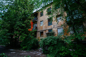 Old overgrown house in ghost town
