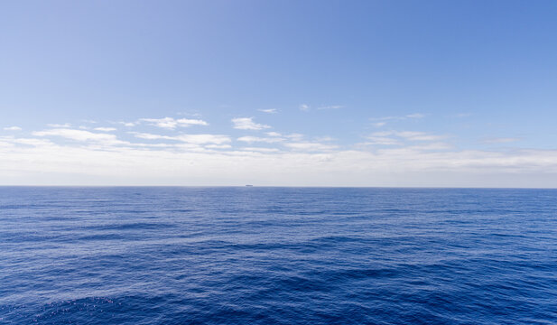 Ocean Horizon With Blue Sky and Scenic Cloudscape Over the Pacific Ocean