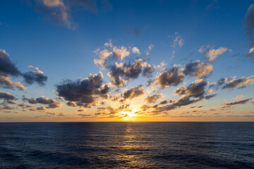 Beautiful Sunset Over Ocean with Vibrant Sky and Dynamic Cloudscape