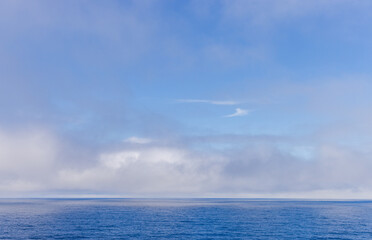 Serene Cloudscape Above the Tranquil Waters of the Pacific Ocean