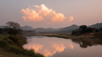 Obraz premium breathtaking sunset over serene landscape with ultrabright cloud dominating sky