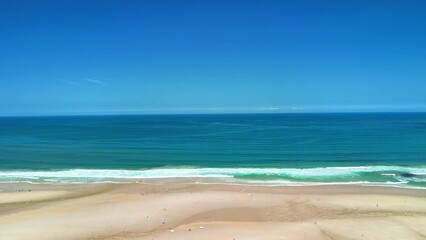 A Serene Beach Landscape Featuring Beautiful, Clear Blue Waters and Soft Sandy Shores