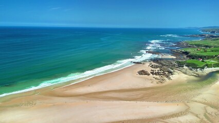 Breathtaking Aerial View of a Gorgeous Coastal Beach and Scenic Natural Landscape