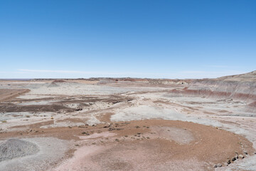 Eroded Desert Landscape at Petrified Forest National Park Under Clear Blue Sky