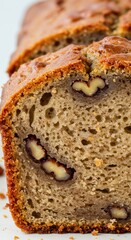 Golden-brown slice of delicious nut bread featuring a delicate crumb structure and baked to perfection, a tempting treat for any occasion.