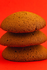 Delicious ginger cookies stacked against a vibrant background