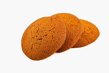 Soft ginger cookies stacked on a white surface