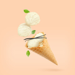 Yummy vanilla ice cream cone and pods in air on beige background