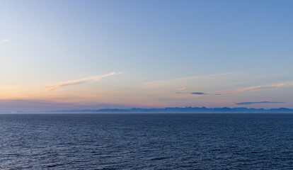 Scenic Sunset Over the Pacific Ocean in BC With Distant Mountains