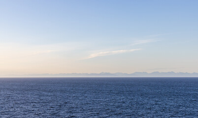 Scenic View of the Pacific Ocean and Distant Mountains on the Horizon