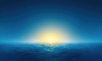 Fototapeta premium Calm ocean at sunset with glowing sun half above the horizon reflecting soft light on smooth water under clear blue sky