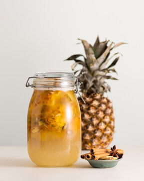 Fermented pineapple drink tepache in a glass jar, selective focus
