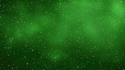 Fototapeta premium Green with white scattered glowing particles creating a cosmic or snowy textured background