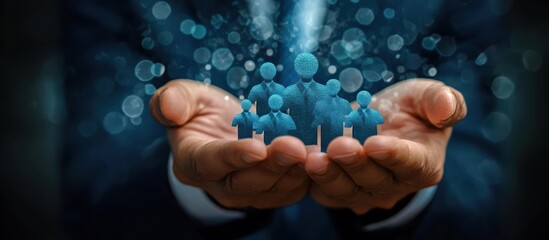 Two hands gently holding glowing blue digital human figures symbolizing care, protection, and community support against a dark blurred background with light bokeh effects