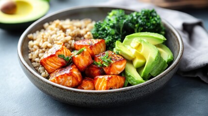 Colorful healthy plate featuring grilled salmon, avocado, and brown rice in bright setting
