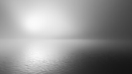 calm water surface under a foggy bright sky creating a tranquil and peaceful atmosphere