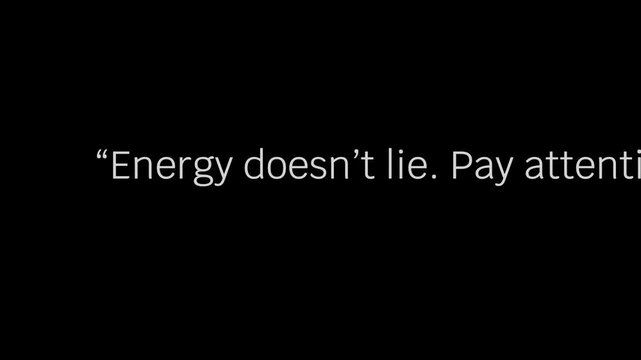 White text on black background quote about energy and attention in quotation marks displayed .