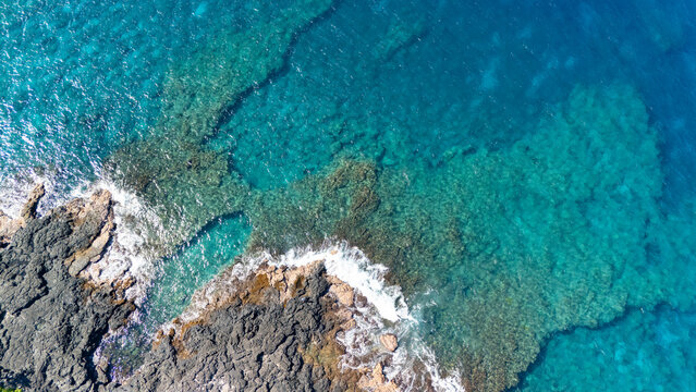 Aerial of ocean shoreline in kona hawaii