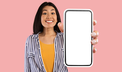 Great Mobile Offer. Excited Asian Lady Showing Big Smartphone With Empty Screen To Camera...