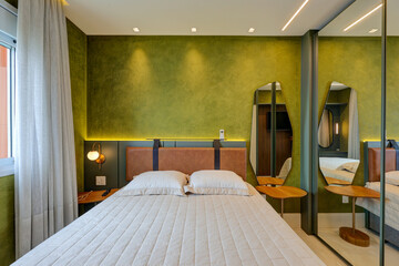 Modern bedroom and bathroom interiors with contemporary design, elegant decor, and natural light in a stylish apartment in Brazil

