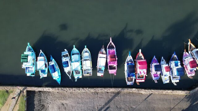 Vibrant boats lined up at Paraty harbor, showcasing the charm of Rio de Janeiro's coastal beauty.