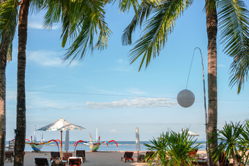 Sanur beach and palm trees in Bali, Indonesia