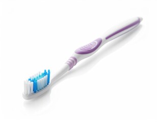 A close-up shot of a toothbrush shows a hygienic tool essential for oral care. The toothbrush features a white handle with lavender and blue bristles