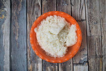 A simple bowl of fluffy white rice ready to be served for a meal.