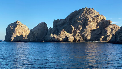 Cabo San Lucas Lands End From Boat Blue Sky with Sun and Shadows