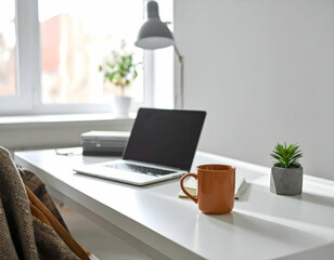 Modern workspace with a laptop, coffee mug, and plants, featuring natural light and a cozy atmosphere