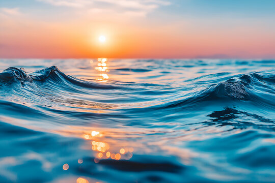 Ocean wave surface at sunset with orange light reflecting on water, Nature and Outdoor Bokeh Concept