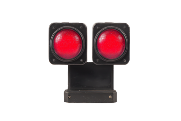 A dual red railway signal light with a rectangular mounting bracket.