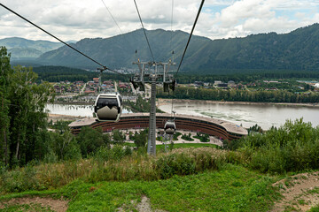 Manzherok resort, Russia. Cable car trip to viewpoints in the mountains. chairlift cab on the...