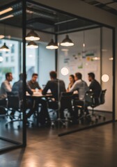 Blurred view of business professionals collaborating during a meeting in modern office